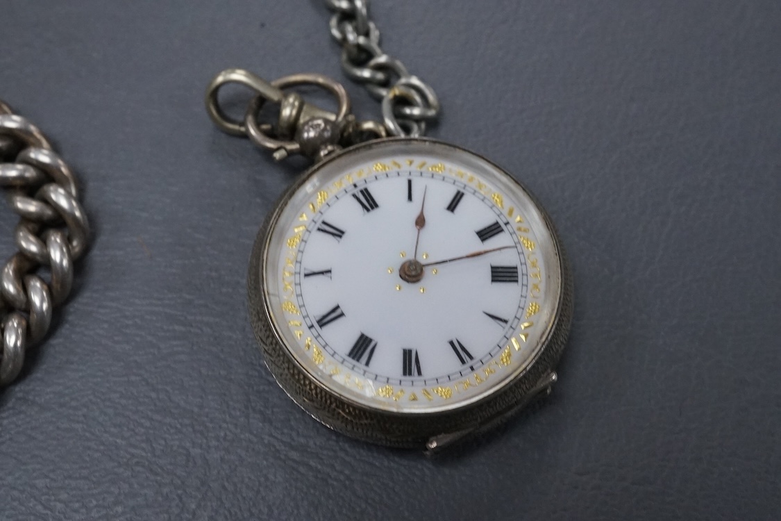 A late Victorian silver open faced key wind pocket watch, with Roman dial and subsidiary seconds, case diameter 52mm, on a heavy silver curb link albert, hung with a silver vesta case and a watch key, together with a con